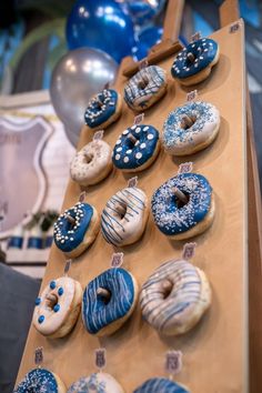 there are many doughnuts on the table ready to be eaten at this party