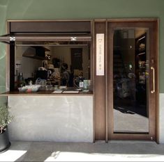 the front door to a coffee shop is open