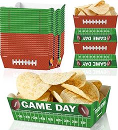 two boxes of game day crackers with footballs on the side and one box filled with chips