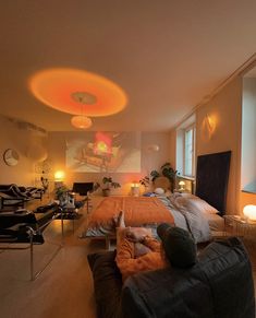 a man laying on top of a bed in a bedroom