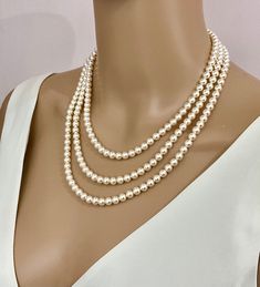 triple strand layered pearl necklace, classic and timeless elegance. Finished in sterling silver, rose gold or yellow gold with famous branded named crystal core pearls made to measure for you. with a Choice to add a pearl drop on the bottom strand or to leave plain. As this is custom made for you, You may choose the best length of the pearls to suit you and choose the pearl colours. The necklace does have a vintage classic inspiration and, as it is finished in sterling silver, it will be a piec Classic Pearl White Multi-strand Necklaces, Classic Multi-strand Pearl White Necklaces, Classic Multi-strand Pearl White Necklace, Elegant Double Strand Necklace For Anniversary, Elegant Single Strand Bridal Necklace, Classic Double Strand Pearl Pendant Jewelry, Classic Double Strand Pearl Chain Necklace, Classic Double Strand Layered Necklace, Classic Pearl White Double Strand Necklace