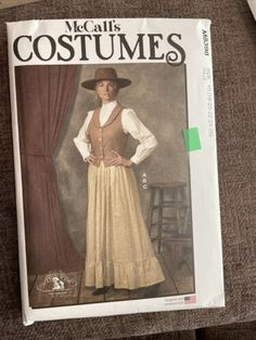 a magazine cover with a woman wearing a dress and hat