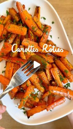 a person holding a fork over a plate of carrots with parsley on top