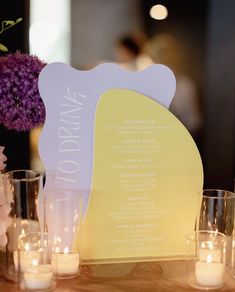 a table with candles and flowers on it