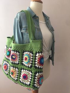 Green Granny Square Shoulder Bag, Granny Square Bag, Crochet Shoulder Bag, Crochet Purse, Boho Crochet Tote Bag, Crochet Beach Tote, Crochet Elevate your style with this exquisite Granny Square Crochet Shoulder Bag, expertly handcrafted in a captivating shade of green. This unique bag is meticulously assembled by combining 19 intricately designed granny square motifs Measurements: Width: 47 cm (18.5 inches) Height: 35 cm (13.7 inches) Total Height with Bag Handle: 57 cm (22.4 inches) Bag Handle Green Granny Square Beach Bag, Bohemian Green Crochet Bags, Green Crochet Bag With Granny Square, Green Crochet Bag With Granny Square For Daily Use, Green Handmade Crochet Bag For Travel, Everyday Green Crochet Bag With Granny Square Detail, Handmade Green Crochet Bag In Bohemian Style, Green Bohemian Crochet Bag For Everyday, Green Crochet Granny Square Bag For Everyday Use