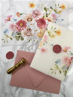 two envelopes, one with a wax stamp and the other with flowers on it