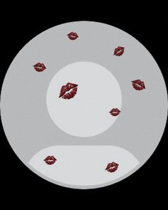 a white plate with red lipstick on it