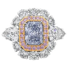 A rare and magnificent engagement ring, showcasing a vibrant 1.09 carats radiant cut diamond certified by GIA as Fancy Light Blue color and VS1 clarity, set on a four prong setting. Accented by a halo of 22 round cut pink diamonds weighing 0.21 carat total with VS clarity, set on 18K yellow gold and an outer halo of 10 round brilliant cut diamonds weighing 1.09 carats total with D color and VS clarity. Flanked by pear shape diamonds weighing 0.97 carat total with D-E color and VS clarity. Finely Oval Sapphire Engagement Ring, Colored Diamond Jewelry, Timeless Engagement Ring, Fancy Light, Double Halo Engagement Ring, Radiant Cut Engagement Rings, Double Halo Engagement, Contemporary Engagement Rings, Blue Diamond Ring