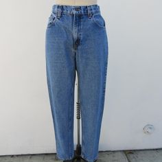 90s Levi's 550 five-pocket jeans. tapered, relaxed fit. Made in Puerto Rico (USA). All cotton. Made in Mexico. Zipper fly.  Label size 9 MED Fit like S M  Measured flat Please compare measurements to a similar garment that fits you well 28" waist   11" rise 37" hips 31" inseam Good vintage condition with light signs of use and age with some slight wear around the edges to round out a nice vintage patina. 90s Levis, Levis 550 Jeans, Levis 550, Porto Rico, Pocket Jeans, Jeans Pants, Trousers Women, Tapered Legs, Denim Pants