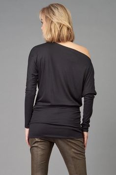 This Banded Bottom Tunic from Lola & Sophie is an absolute catch! It features a modern, flattering design and a hemline with a band detail to flatter your figure. Perfect for a playful day-out, you'll be feeling as light as a feather in this go-to, comfy tunic! Details Length: 31" from Shoulder Tight Rib Band on Bottom Tight Rib Cuff Can be worn Off-The-Shoulder Model is 5'10" and is wearing size S 94% Rayon 6% Spandex Care Machine wash cold, lay flat or hang to dry. Modern Tops With Asymmetrical Neckline For Fall, Modern Top With Asymmetrical Neckline For Fall, Modern Fall Tops With Asymmetrical Neckline, Modern Tops For Night Out In Fall, Light As A Feather, Tunic Styles, Black Steel, Off The Shoulder, Off Shoulder