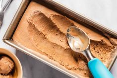 scoops of ice cream in a pan with spoons