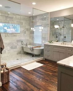 a bath room with a tub a sink and a mirror on the wall in it