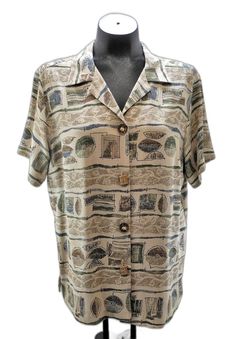 Vintage Teddi tribal print shirt women's size 12.  Beige with tribal print in brown, olive green, tan, blue and black. Unique faux bone buttons add nice detail. Open, notched collar with short sleeves and straight hem with slits at the side. Gently worn, in excellent condition.  54% Rayon, 46% Acetate; Machine Wash. Measurements are taken across flat, unstretched garment:  Chest (underarm to underarm): 21-1/2" Sleeve (shoulder seam to end of cuff): 8-3/4" Overall Length (from nape of neck): 26" Print Shirts Women, Print Shirt, Printed Shorts, Womens Clothing Tops, Short Sleeve Shirt, Favorite Outfit, Sleeve Shirt, Womens Shirts, Bathing Beauties