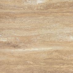 a close up view of the surface of a marble countertop with brown and tan colors