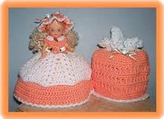 two crocheted dolls sitting next to each other