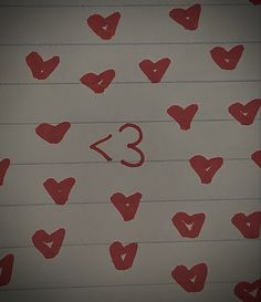 red hearts drawn on lined paper with the number thirteen