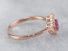 This ruby ring is classic with a twist! The marquise cut of the ruby is flattering on the hand, with diamond accents that add lots of sparkle. Bypass style shoulders create a sense of movement and bring this ring to life! Metal: 14K Rose Gold Gem: Ruby .20 Carats Gem Measurements: 3.1 x 6 mm, Marquise Cut Accents: 6 White Sapphires totaling .15 Carats Ring Size: 8.25 Marks: "14K China" Stamped on the inside band Gem Ruby, Ruby Diamond, Ruby Ring, Marquise Cut, White Sapphire, Rose Gold Ring, Gold Ring, Gold Rings, Gold Bracelet