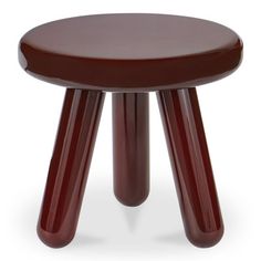 the stool is made from wood and has an unusual shaped design on it's legs