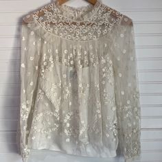 Worn A Few Times But In Perfect Condition Needle And Thread Lacey Blouse! With A Detachable Tank Top Underneath! Size 4 Chic Spring Blouse With Lace Work, Chic Lace Work Blouse For Spring, Long Sleeve Lace Top For Spring Wedding, Spring Wedding Long Sleeve Lace Top, Cream Tops For Fall Wedding, Cream Tops For Wedding In Fall, Feminine Tops For Fall Wedding, Spring Wedding Blouse With Lace Work, Cream Tops For Spring Festivals