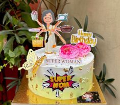 a birthday cake with an image of a woman on top and decorations around the edges