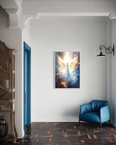 a blue chair sitting in front of a painting on the wall next to a doorway