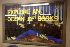 there is a window with an advertisement on it that says explore an ocean of books