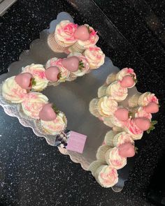 cupcakes are arranged in the shape of a heart