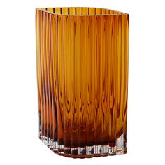 an orange glass vase sitting on top of a table