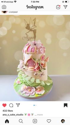 a three tiered cake decorated with pink and green decorations