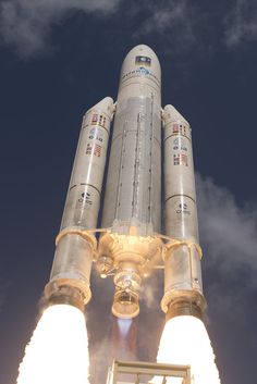 the space shuttle lifts off into the sky