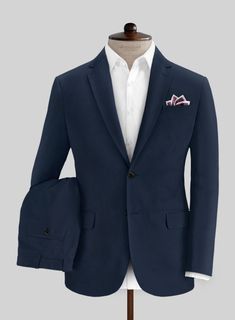 Don't let the scorching weather ruin your sense of style. Our Italian Mirage Blue Cotton Stretch Suit seamlessly merges classic style with contemporary elegance. Meticulously crafted from a premium blend of cotton and lycra, this suit features a solid blue hue that gives it a modern edge in your wardrobe. Try draping our suit for a flawless look.  Look Includes   Italian Mirage Blue Cotton Stretch Fabric  Two Button Jacket Style  Notch Lapel   Horn Royal Black  Buttons  Single Vent  Three Cuff Buttons  Two Welted Back Pockets on Trousers   Click 'Customize Now' to modify the look if needed.   Lining: Viscose; Dry Clean. Button Jacket, Summer Suits, Jacket Buttons, Black Button, Blue Hues, Jacket Style, Summer Wear, Horn, Nuts