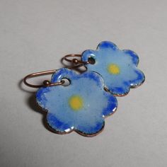 "Sweet blue enameled copper flower earrings.  .75\" diameter. My enameled items are made with love using glass powder enamels on copper, kiln-fired to about 1500oF, and require many layers and firings. Backs are finished with enamel, and pieces are set with copper findings. I have been in the glassworking and jewelry-making trades since 1994 and have a deep love and respect for glass of any kind. SOLID TITANIUM EARWIRES ARE AVAILABLE FREE UPON REQUEST - please message me during checkout." Nickel-free Blue Flower Earrings, Vintage Blue Flower Earrings Nickel Free, Blue Vintage Flower Earrings Nickel-free, Nickel-free Blue Enamel Jewelry, Nickel-free Enamel Flower Earrings, Vintage Blue Flower Earrings, Nickel-free, Blue Enamel Hypoallergenic Jewelry, Vintage Blue Hypoallergenic Earrings, Blue Hypoallergenic Copper Earrings