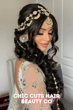 a woman with long hair wearing a headpiece