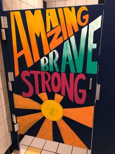 an open door with the words amazing brave and strong painted on it