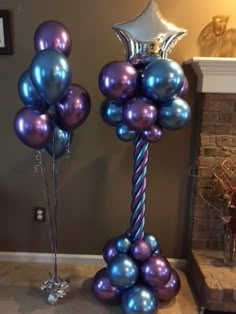 some balloons that are in the shape of stars on top of each other and one is purple