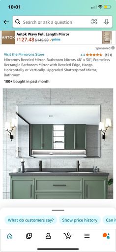 an image of a bathroom with green cabinets and gray counter tops, which is also on the internet