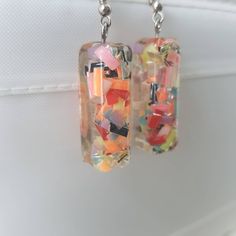 This is a beautiful pair of confetti earrings, made with resin. Very cute Shipping is registered I can combine shipping for multiple items Playful Resin Dangle Earrings, Fun Resin Drop Earrings, Unique Resin Earrings For Parties, Fun Resin Dangle Earrings, Artsy Resin Drop Earrings, Trendy Multicolor Resin Earrings, Multicolor Resin Drop Earrings, Multicolor Resin Earrings For Pierced Ears, Artsy Resin Dangle Earrings