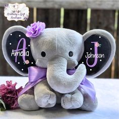 an elephant stuffed animal with a name on it