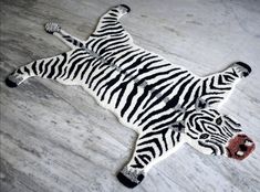 a fake zebra laying on the ground