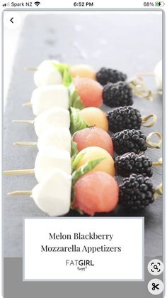 an appetizer is displayed with fruit on skewers and the words melon blackberry mozzarella appetizers