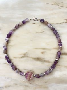 A necklace made of natural stone suitable for holidays and everyday wear, for office and concert, a gift for mom, sister, or a friend for their birthday, wedding day, Christmas, or Valentine's Day. A personalized meaningful gift based on the zodiac sign and moon phase. A Fluorite charm, 0.88 ounces in size, supports fluorite 6mm beads and hematite inlays. Steel hardware, lobster clasp. Lithotherapy. Adjustable Single Strand Amethyst Necklace, Purple Beaded Necklaces With Natural Stones As Gift, Lavender Gemstone Beaded Necklace For Gift, Lavender Single Strand Necklace As Gift, Single Strand Amethyst Necklace Gift, Adjustable Amethyst Bead Necklaces, Lavender Handmade Necklace For Meditation, Lavender Single Strand Necklace Gift, Lavender Single Strand Necklace For Gift