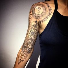 a woman with a tattoo on her arm