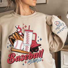 Elevate your softball mom style with our Bougie Retro Baseball Mom Sweatshirt, personalized with your kids' names elegantly printed on the sleeve. This unisex heavy blend crewneck sweatshirt is the epitome of comfort and style, making it perfect for any occasion. Crafted from a cozy blend of polyester and cotton, this sweatshirt ensures your designs come out looking fresh and beautiful while providing exceptional comfort. The ribbed knit collar retains its shape wash after wash, ensuring a lasti Softball Mom Sweat Shirt, Mama Crewneck, Baseball Mom Shirt, Retro Baseball, Baseball Mom Shirts, Kids Names, Softball Mom, Sweatshirt Cute, Mom Sweatshirt