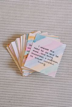 five cards with the words, one is written on them and four are folded in different colors