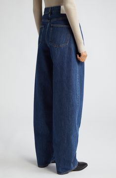 Relaxed yet dramatic, these mid-wash jeans are crafted from nonstretch Italian denim with a high waist and full-length tapered legs. 34" inseam; 17" leg opening; 11 1/2" front rise; 14" back rise (size 26) Zip fly with button closure Front scoop pockets; coin pocket 100% organic cotton Hand wash, line dry Made in Italy Designer Clothing This brand has B Corp certification, representing business practices with emphasis on social and environmental performance, accountability and transparency This Modern High-rise Denim Blue Jeans, Modern High Rise Denim Blue Jeans, Modern Dark Wash Denim Jeans, Modern Full Length Medium Wash Jeans, Modern High-waist Denim Blue Jeans, Modern High Rise Jeans In Recycled Denim, Modern High Waist Denim Jeans, Modern High-rise Recycled Denim Jeans, Modern High Rise Recycled Denim Jeans