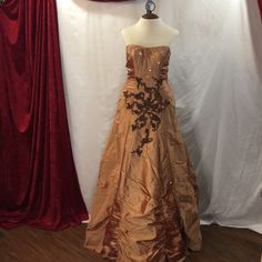 Gold Strapless Ball Gown. Brown Floral Appliqu Accents Strapless Gold Evening Gown, Gold Strapless Evening Gown, Silk Strapless Floor-length Wedding Dress, Teal Midi Dress, Strapless Ball Gown, Red Sleeveless Blouse, Short Green Dress, Dress With Ruffle Sleeves, Snake Skin Dress