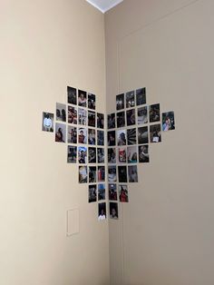 a room with several pictures arranged on the wall