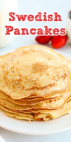 a stack of pancakes sitting on top of a white plate