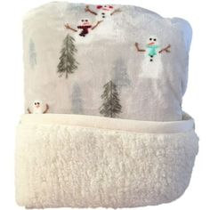 a white towel with snowmen and trees on it