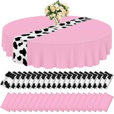 a pink table cloth with black and white polka dots on it